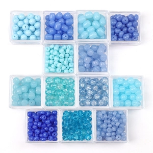 Blue glass bead assortment for DIY jewelry with round and cracked textures