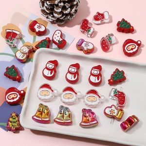 Macro shot of colorful Christmas resin charms like Santa and snowmen for DIY jewelry