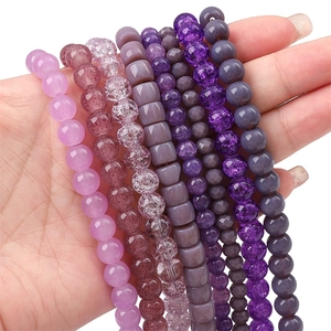 Assorted purple glass crystal beads in round and faceted shapes for DIY jewelry making