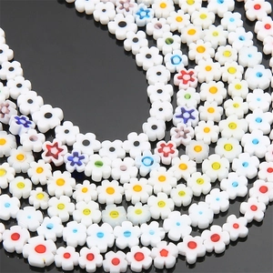 Macro view of plum blossom glass beads with colorful patterns for DIY jewelry making