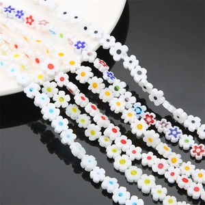 Macro shot of colorful plum blossom glass beads for DIY necklace and jewelry making