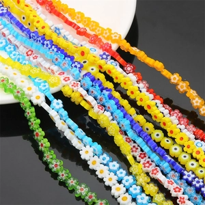 Macro shot of colorful plum blossom glass beads for DIY necklaces and handmade jewelry