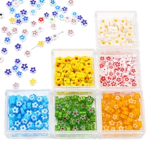 Colorful plum blossom glass beads set for DIY jewelry making in a clear storage box