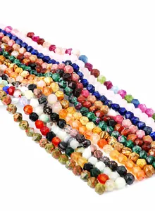 Macro detail of multi-faceted natural stone beads including agate and quartz crystal