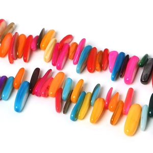 Macro shot of colorful bar-shaped natural shell beads for DIY jewelry making with luster