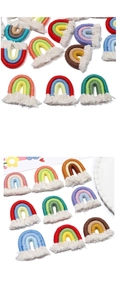 Detailed macro view of handmade macaron cotton rope rainbow pendants with white tassels