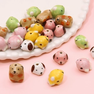 Hand-painted ceramic animal beads featuring cute dog and panda shapes for DIY jewelry making