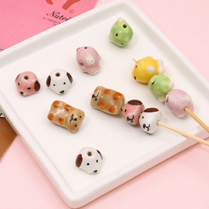 Handmade ceramic animal beads in cute puppy and panda shapes for DIY jewelry making