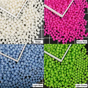 Detailed view of DIY textured pearl beads in beige, rose, light blue and green