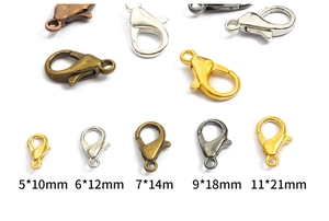 Detail of alloy lobster clasps in various sizes and metallic finishes for DIY jewelry making