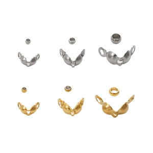 Macro detail of stainless steel crimp beads and clasp sets in gold and silver finishes