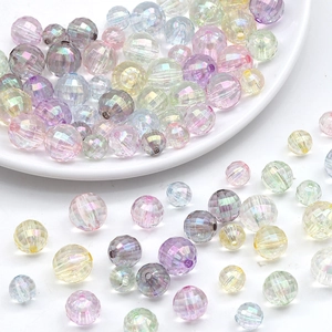 Macro shot of 12mm iridescent faceted acrylic beads in colorful macaron shades for DIY