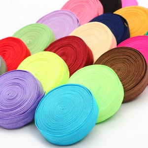 Colorful elastic bands for DIY crafts in multiple rolls showing woven texture and high gloss