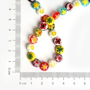 Macro shot of 8mm millefiori glass beads with floral patterns for DIY jewelry making