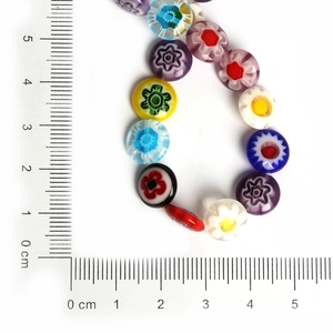 Detailed view of 10mm millefiori floral glass beads next to a ruler for DIY jewelry