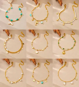 Detail of nine gold-plated layered anklets with starfish, shell, and daisy charms