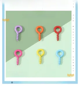 Close-up of colorful spray-painted metal eye screws for DIY jewelry making and crafts