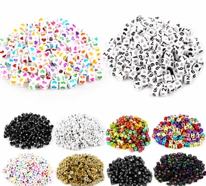 Macro shot of assorted colorful acrylic square beads with letters and numbers for DIY jewelry