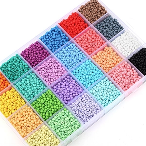 Close-up of 24-grid storage box with colorful 3mm seed beads for DIY jewelry making