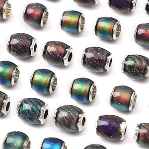 Macro detail of cosmic nebula resin large hole charms with silver alloy cores