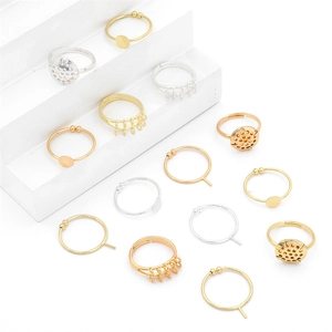 Detailed macro view of 14K gold and silver plated adjustable ring bases for DIY jewelry