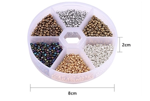 Detail view showing a 6-compartment box with 2-3mm glass beads for DIY jewelry making