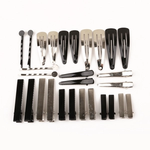 Set of black and silver metal hair clips in various sizes including BB and alligator styles