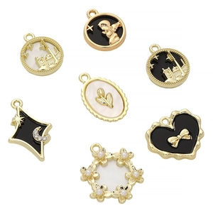 7-piece set of romantic gold alloy pendants with black and white enamel and pearls