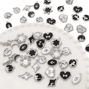 Macro view of vintage style silver alloy charms for DIY necklaces and jewelry making
