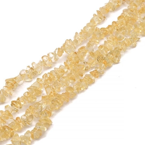 Close-up of yellow natural irregular crystal stone beads for DIY jewelry making