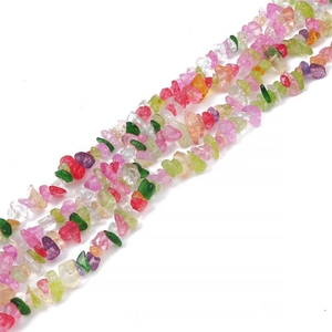 Macro shot of colorful irregular crystal gravel beads for DIY jewelry making and crafts