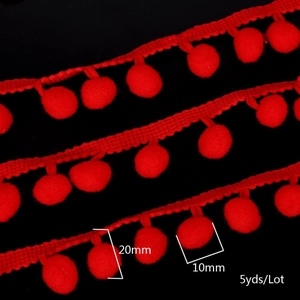 Detail of red 10mm pom pom trim fringe showing 20mm total width and 10mm ball diameter