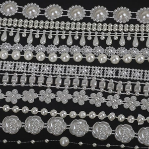 Selection of white ABS pearl trim styles including flower and teardrop shapes for DIY sewing