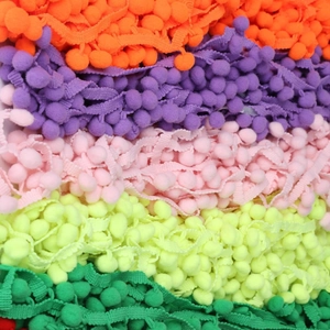 Colorful 10mm pom pom fringe trim in vibrant neon colors for DIY sewing and crafts