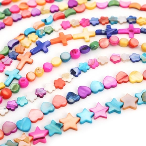 Colorful natural shell beads in various shapes like stars and hearts for DIY jewelry