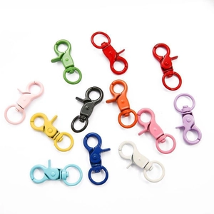 Close-up of colorful alloy lobster swivel clasps for DIY keychain making in various vivid colors