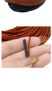 Detail view of 2mm black and brown synthetic leather cords for DIY jewelry weaving