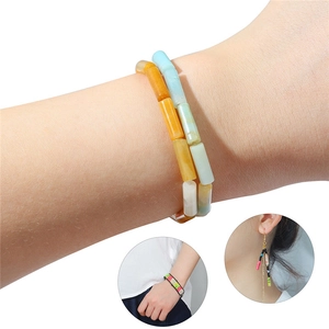 Colorful cylindrical bead bracelet and earring set with vibrant handmade jewelry materials