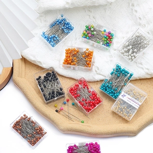 Close-up of colorful round pearl head pins in stainless steel for DIY jewelry making