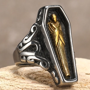 Gothic punk coffin ring in vintage titanium steel with a detailed golden mummy figure