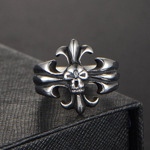 Macro detail of gothic skull ring with cross pattern and vintage oxidized metal finish