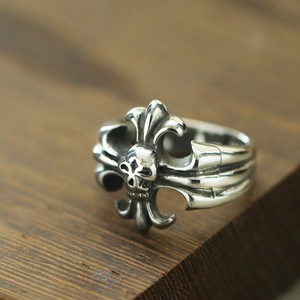 Macro detail of gothic skull and fleur-de-lis relief on vintage titanium steel ring