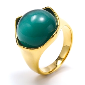 Close-up of a gold titanium steel ring featuring a large green cat eye stone inlay