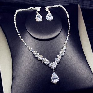 Elegant silver bridal jewelry set with pear-cut crystal necklace and matching earrings