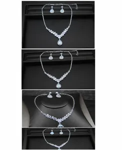 Detail of silver bridal jewelry set featuring pear-cut crystals on a necklace and earrings