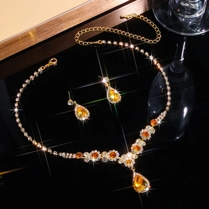 Macro detail of bridal jewelry set with sparkling rhinestones and teardrop crystals
