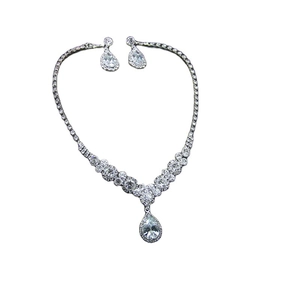 Elegant bridal silver necklace and earring set with pear-shaped crystal pendants