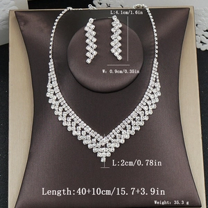 Close-up of silver rhinestone necklace set with detailed length and weight specifications