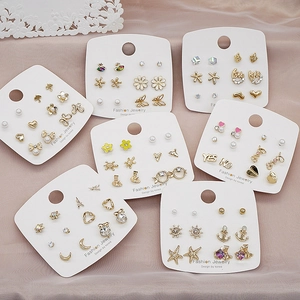 Detailed view of 925 silver needle stud earring sets with pearls and rhinestones