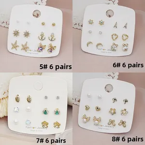 Detail of four sets of 925 silver needle earrings with pearls and crystal motifs